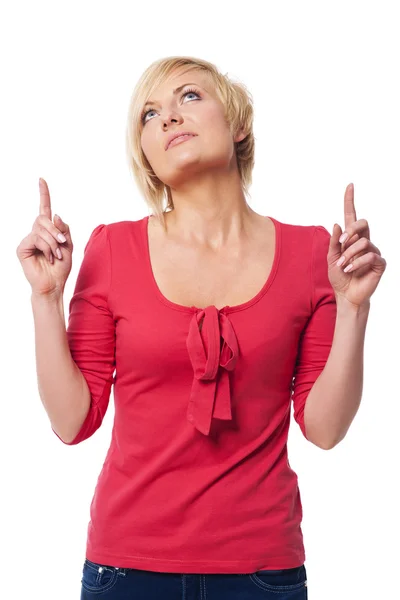 Young woman showing something above her head — Stock Photo, Image