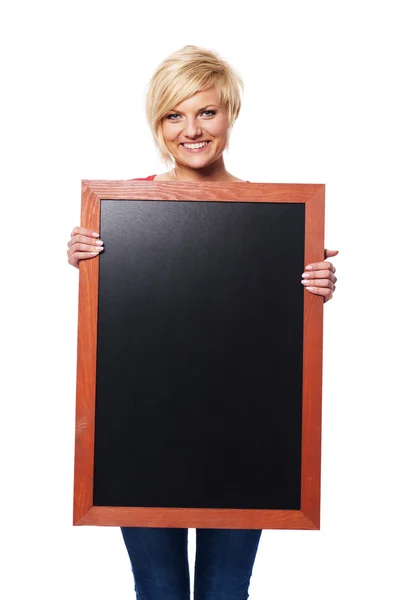 Blonde young female with blackboard — Stock Photo, Image