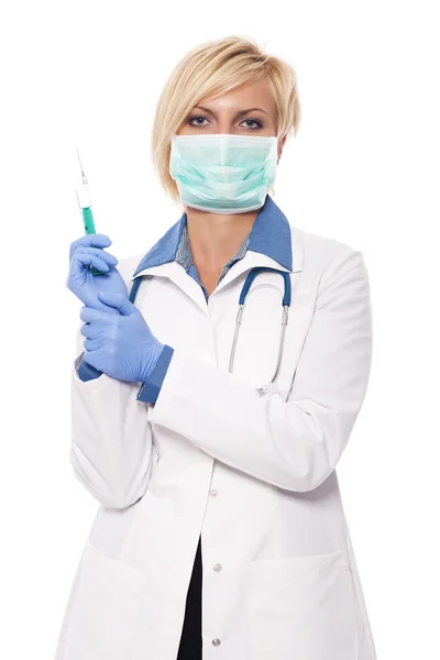 Female doctor holding syringe — Stock Photo, Image