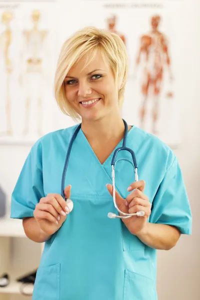 Young and beautiful surgeon posing at her office — Stock Photo, Image