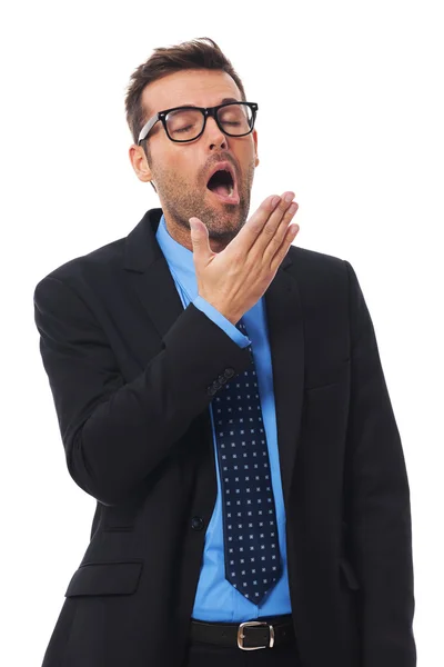 Businessman covering mouth and yawning — Stock Photo, Image