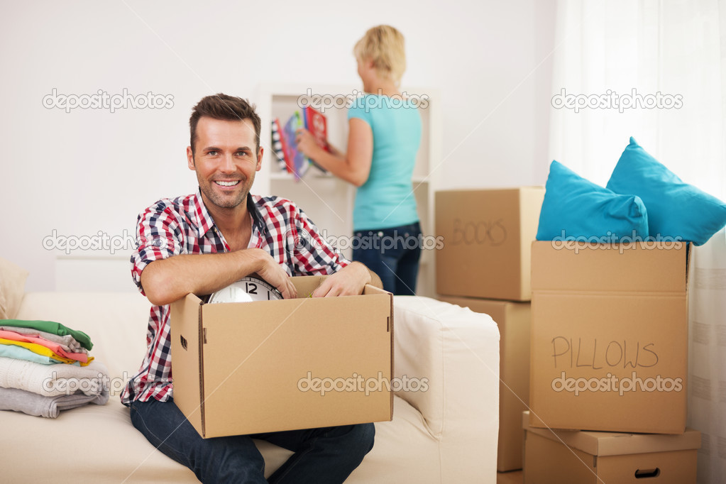 Couple unpacking in their new home