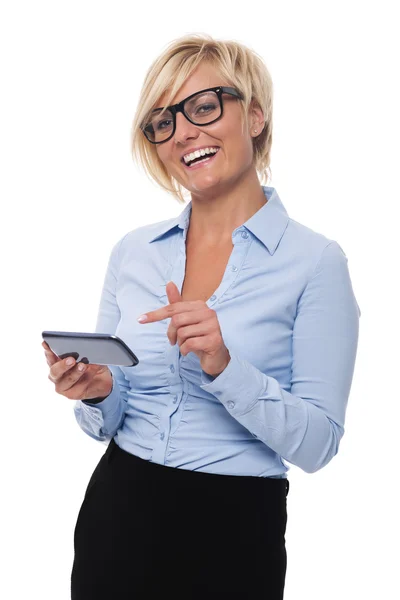 Businesswoman pointing on mobile phone — Stock Photo, Image