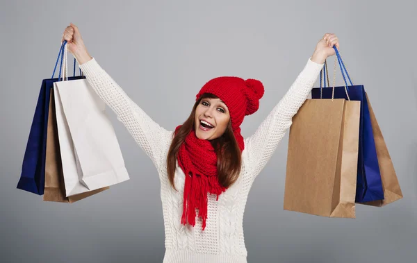 Mujer sosteniendo un montón de bolsas de compras — Foto de Stock