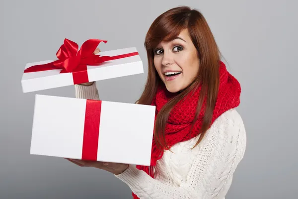 Woman opening christmas gift — Stock Photo, Image