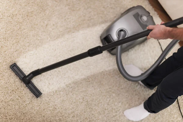 Vacuuming a carpet