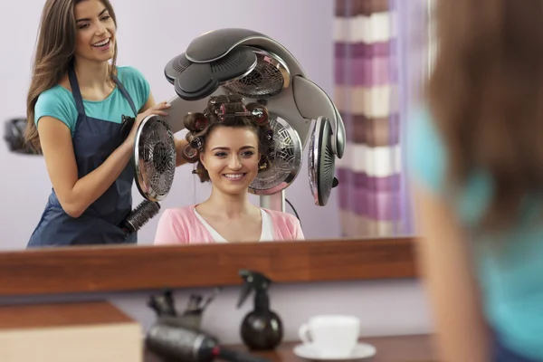 Customer under hair dryer — Stock Photo, Image