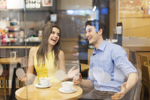 Smiling couple in cafe