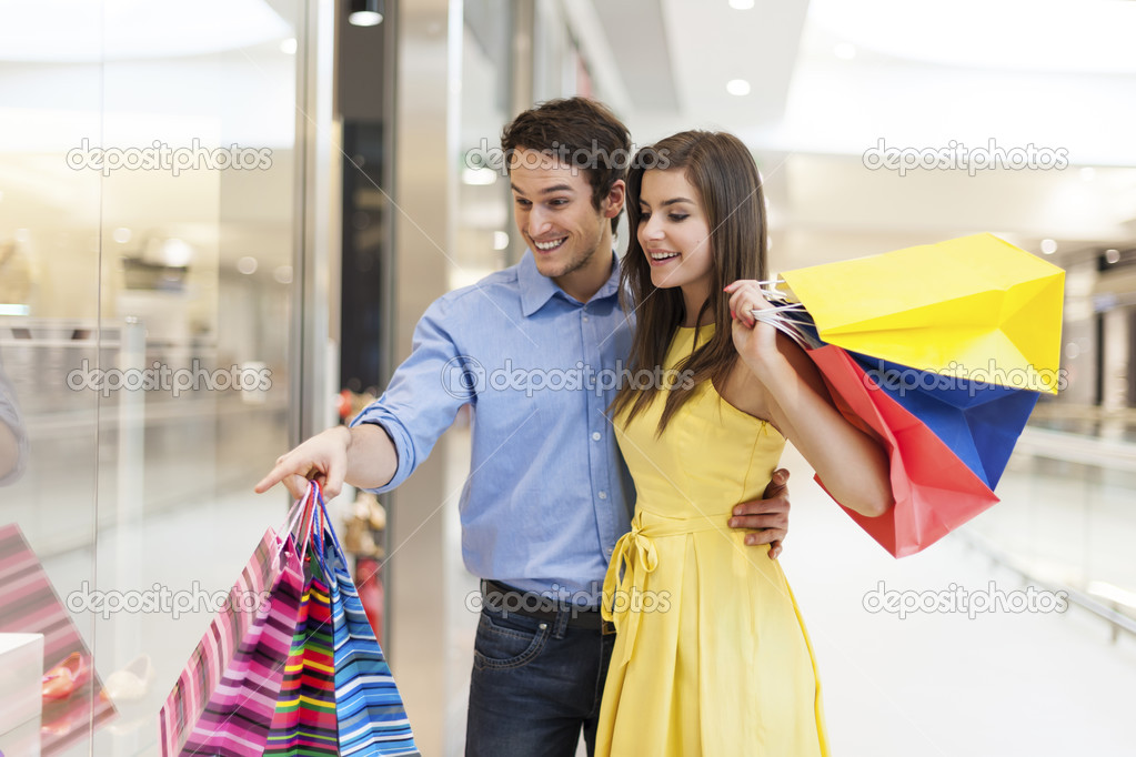 Couple looking on window shopping