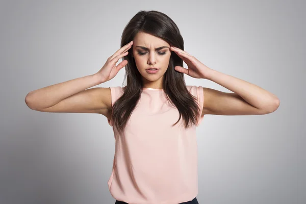 Woman with a migraine — Stock Photo, Image