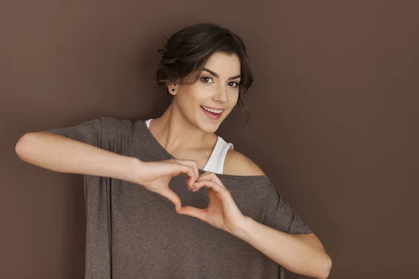 Woman with heart sign — Stock Photo, Image