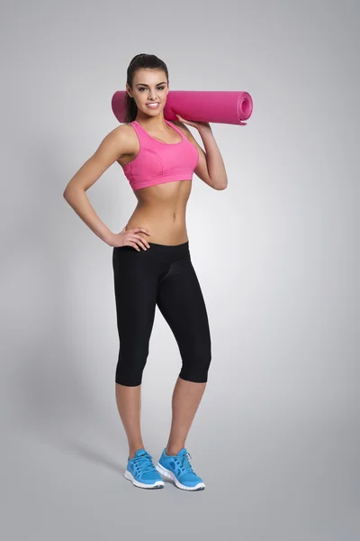 Woman with exercise mat — Stock Photo, Image