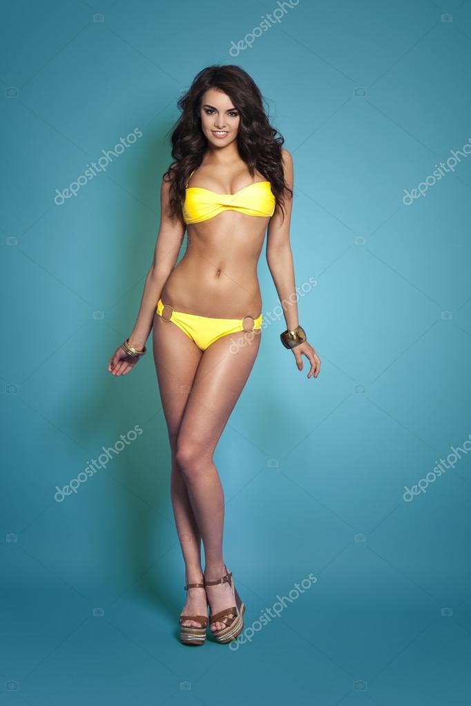 Sexy Woman Wearing Yellow Bikini Stock Photo By Gpointstudio
