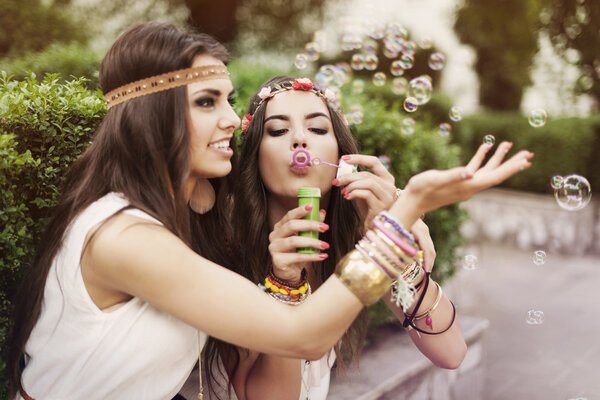 Girls blowing bubbles