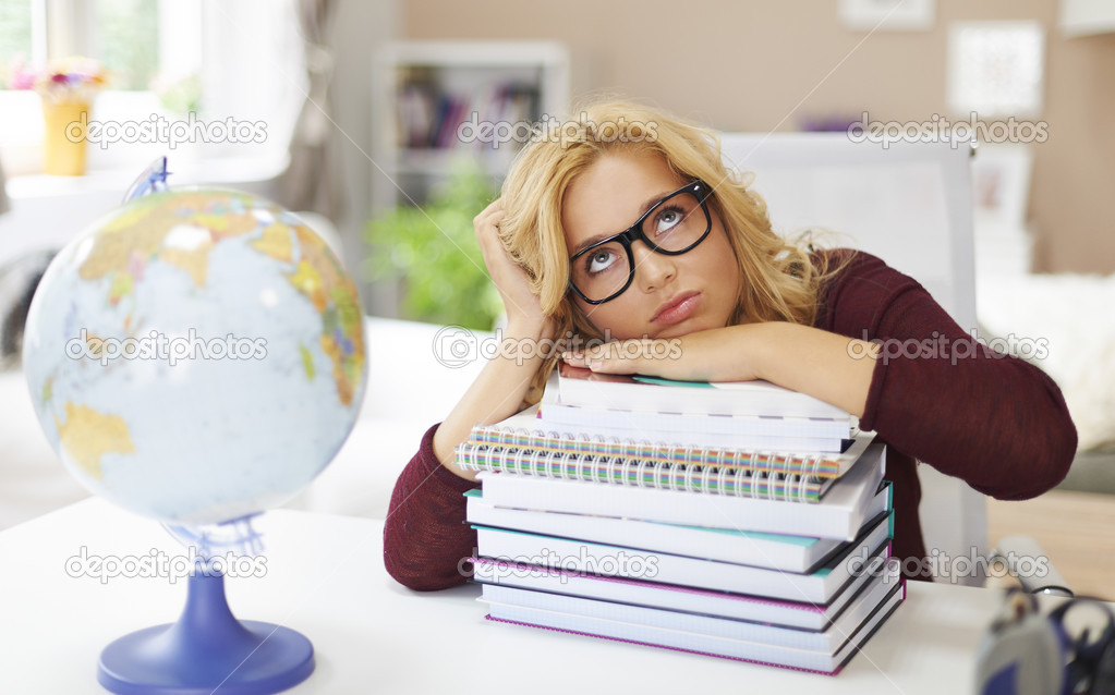 Girl with stack of books