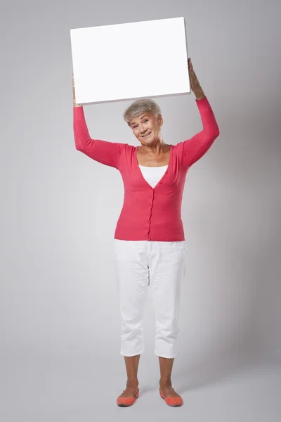 Woman with empty whiteboard — Stock Photo, Image