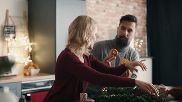 Couple Preparing Christmas Decorations Together Shot Red Helium Camera — Stock Video
