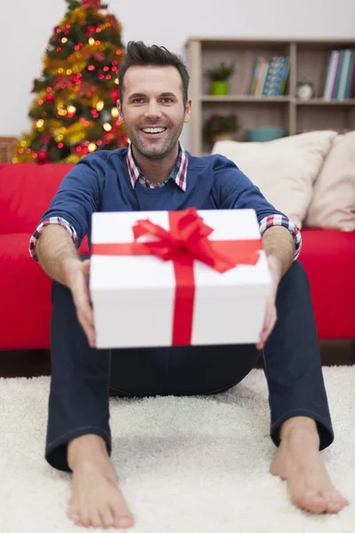 Man with Christmas present — Stock Photo, Image