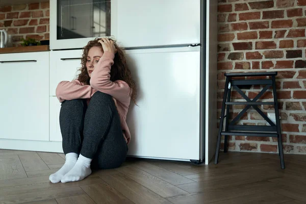 Sad Thoughtful Young Caucasian Woman Sitting Floor Kitchen — Stock Photo, Image