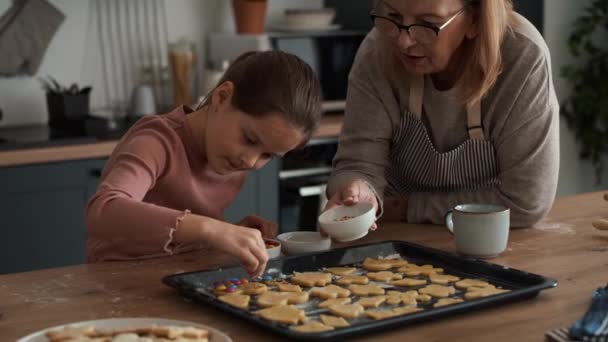 Caucasian Girl Decorating Homemade Cookies Grandmother Shot Red Helium Camera — Stock Video