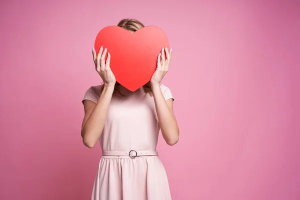 Attractive Woman Hiding Heart Shape Sign — Stok fotoğraf