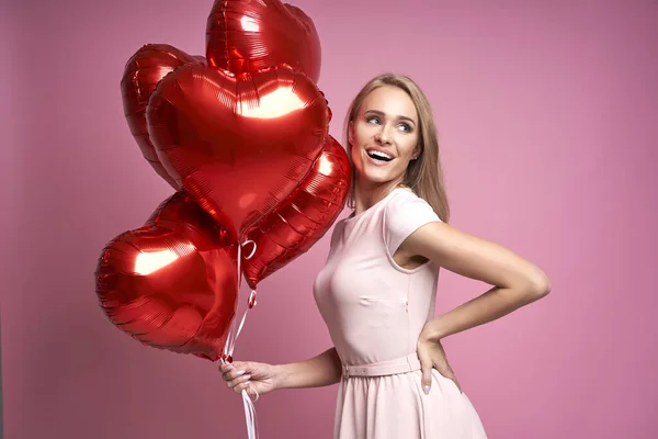 Beautiful Caucasian Woman Pink Balloons Pink Background Looking Away — стоковое фото