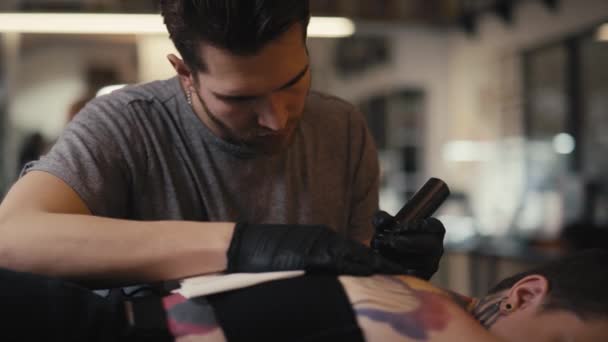 Caucasian Man Tattooing Woman Studio Shot Red Helium Camera — Stock Video