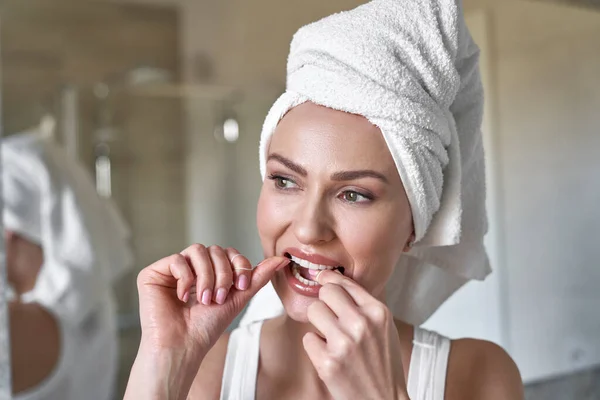 Close Young Caucasian Woman Flossing Teeth Bathroom — стоковое фото