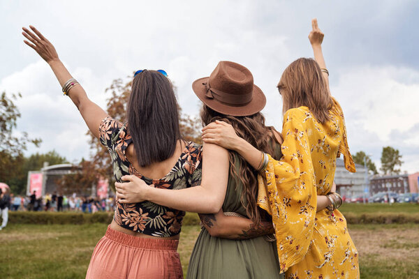Group of friends enjoying the party at the music festival 