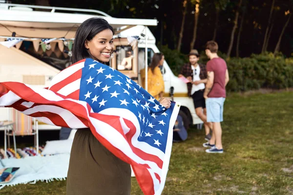 Young Mixed Race Woman Covered Usa Flag Her Friends Celebrating — Zdjęcie stockowe
