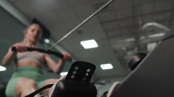 Close Caucasian Woman Exercising Rowing Machine Shot Red Helium Camera — Stockvideo