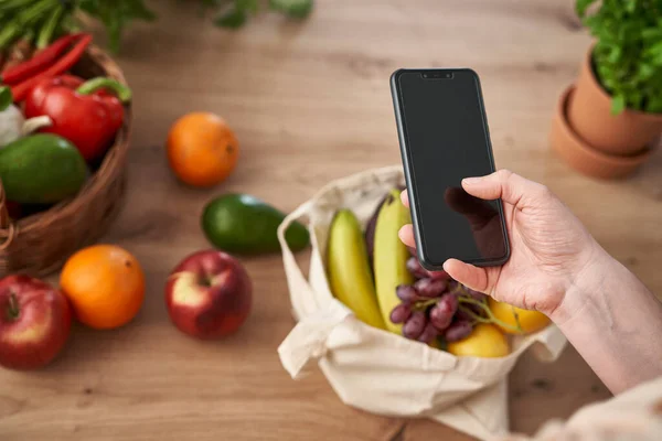 Woman Using Mobile Phone Shopping Bag Full Fruits Vegetables — Stok fotoğraf