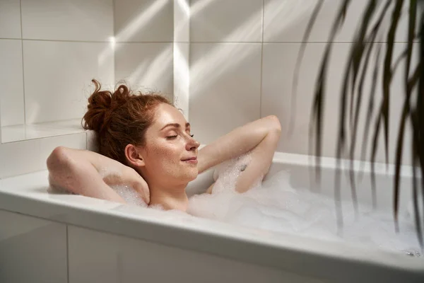 Young Redhead Woman Taking Bath Eyes Closed — Zdjęcie stockowe
