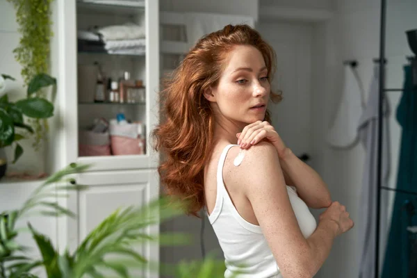 Redhead Woman Moisturizing Skin Arm Bathroom — Stock Photo, Image