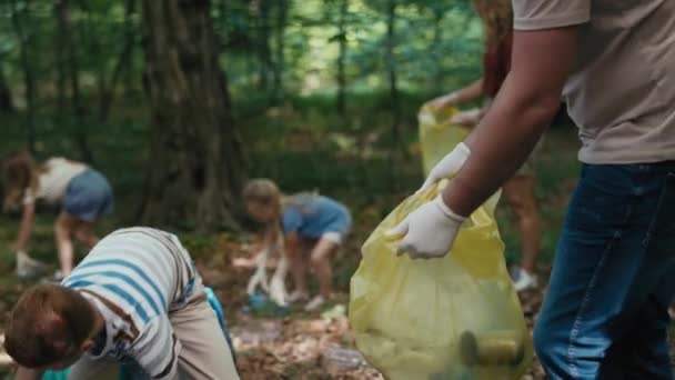 Caucasian Boy Cleaning Forest Trashes Family Shot Red Helium Camera — Stockvideo