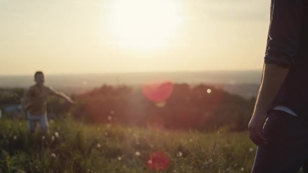 Little Boy Running Dad Meadow Sunset Shot Red Helium Camera — Stock Video