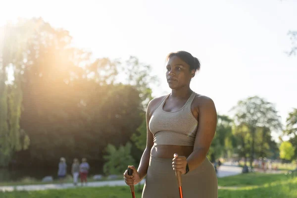 Focus Young African American Woman Exercising Nordic Walking Park Summer — Stock fotografie