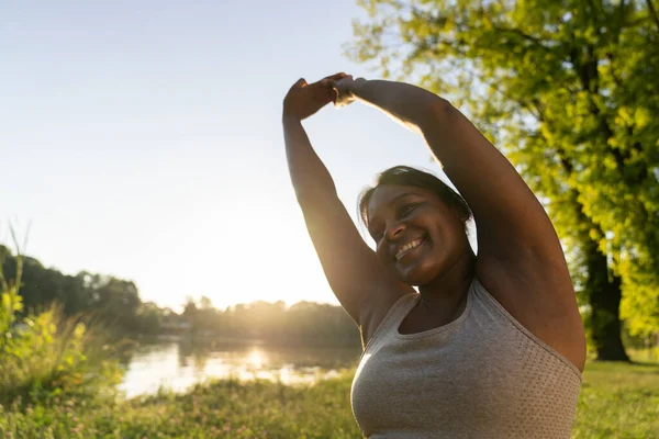 Sized African American Woman Exercising Park Summer Day — стокове фото