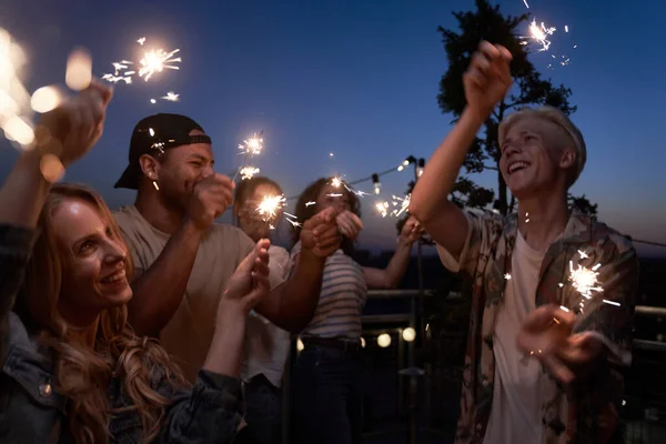 Group Friends Celebrating Together Rooftop Sparkles — стоковое фото