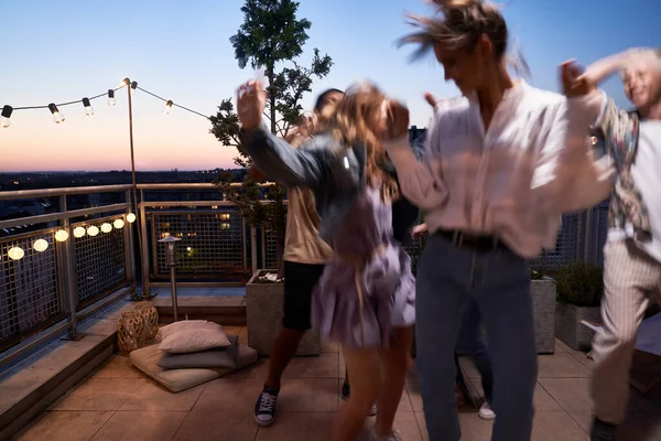 Group Friends Dancing Rooftop Party Evening — стоковое фото