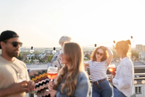 Group of friends have a party during the sunset in the city