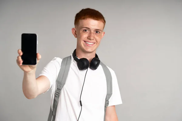 Ginger Male Student Holding Showing Mobile Phone — Stockfoto