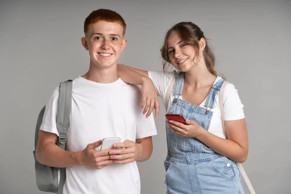 Young Students Using Mobile Phone Camera Grey Background — Foto Stock