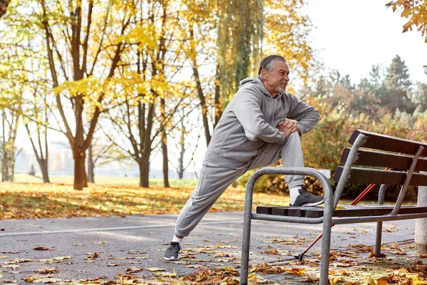 Senior Caucasian Man Stretching Park — стоковое фото