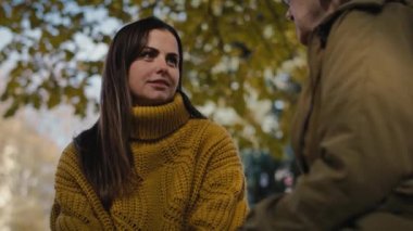 Close up caucasian woman talking with senior woman in park. Shot with RED helium camera in 4K