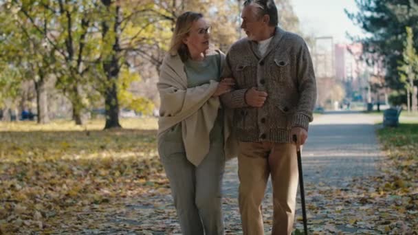 Senior Couple Walking Together Park Autumn Shot Red Helium Camera — Wideo stockowe