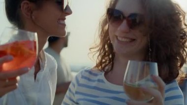 Two caucasian girls dancing the roof top in sunny day. Shot with RED helium camera in 8K. 