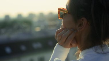 Caucasian young woman enjoying the sunlight on her face. Shot with RED helium camera in 8K.  