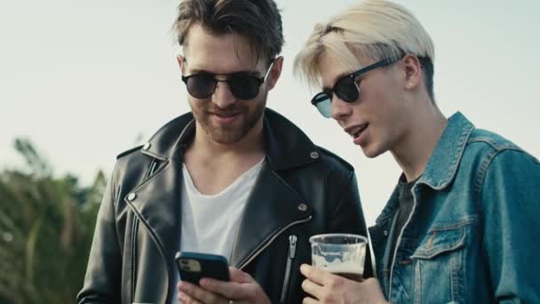 Two Young Caucasian Men Browsing Phone Having Fun Music Festival — Stock video