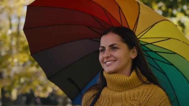 Caucasian Woman Walking Colourful Umbrella Park Shot Red Helium Camera — Stockvideo